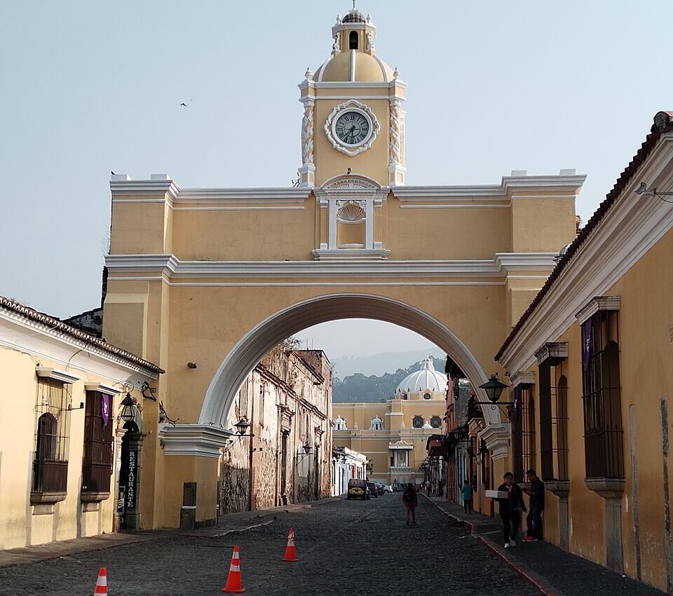 The Santa Catalina Arch in Antigua Guatemala, with a cobblestone street